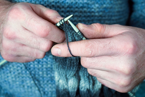 Knitting like hobbies handmade. Hands knitting men close-up. Nikon D5300