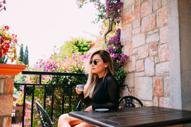 istock Blonde Woman Drinking Turkish Coffee 1153510902