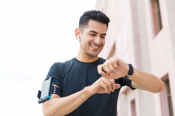 istock Checking Fitness Stats On Smart Watch 1153512333