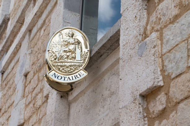 two plate notary in building office for french Notaire French notaire sign on wall above entrance to the notary office notary stock pictures, royalty-free photos & images