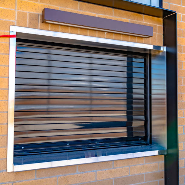 istock Square frame Close up of a building with glossy industrial roller shutter on the window 1153512580