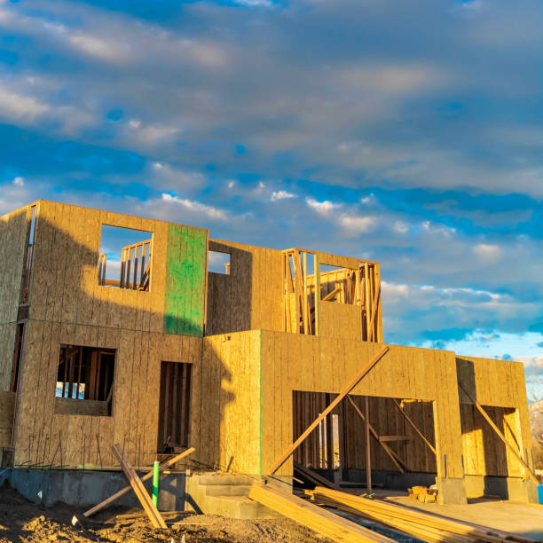 istock Square Framework of a house under construction viewed on a bright sunny day 1153512581
