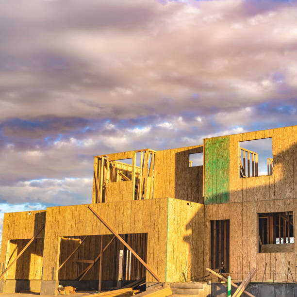 istock Square frame Framework of an unfinished house with no roof at a construction site 1153512586