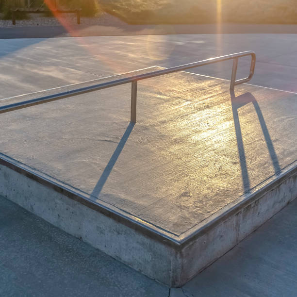 istock Square frame Concrete square platform at a park viewed on a sunny day 1153515747