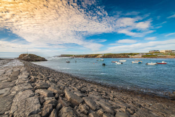 View of the break water in Bude Bay in Cornwall at dusk.