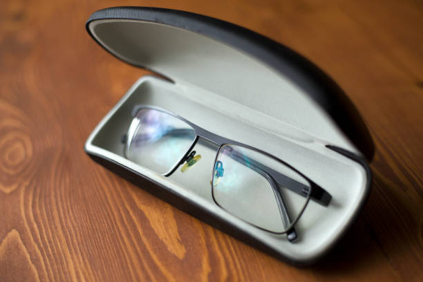 istock spectacles for improving sight in a case on a dark wooden background 1153517083