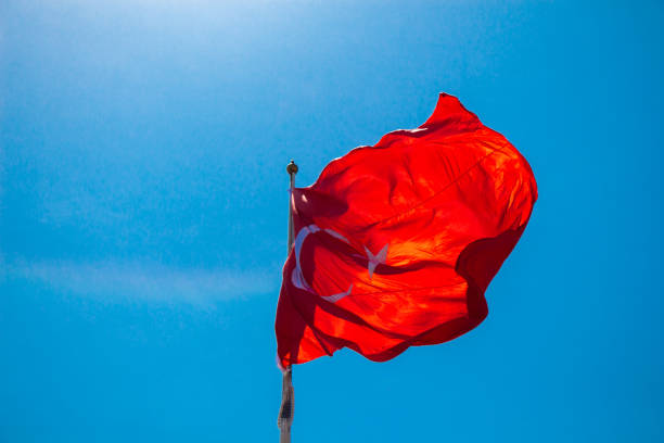 istock Turkish national flag with white star and moon in sky 1153517264
