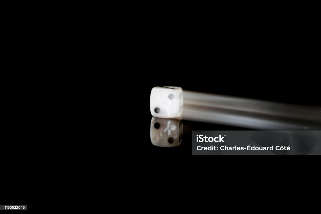 Die Moving Moving Die On A Reflective Surface With Black Background Stock Photo ...
