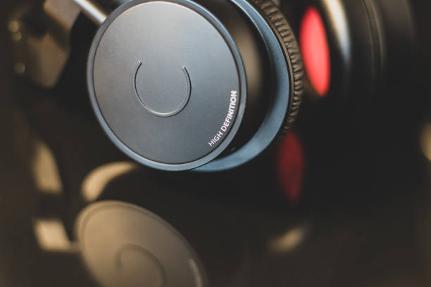 High definition earphone with nice reflection in focus. Isolated concept for music and technology