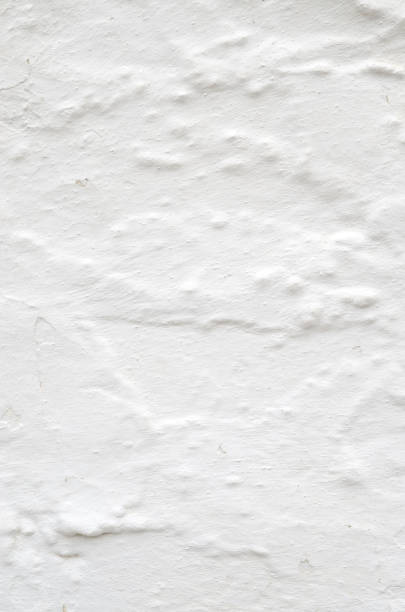 istock New white painted old plaster on wall closeup 1153526046