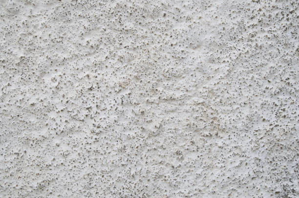 istock White painted old plaster on wall closeup 1153526056