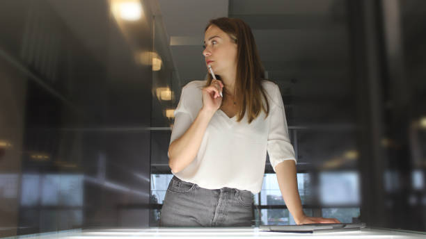 istock Young woman writing on her tablet 1153530204
