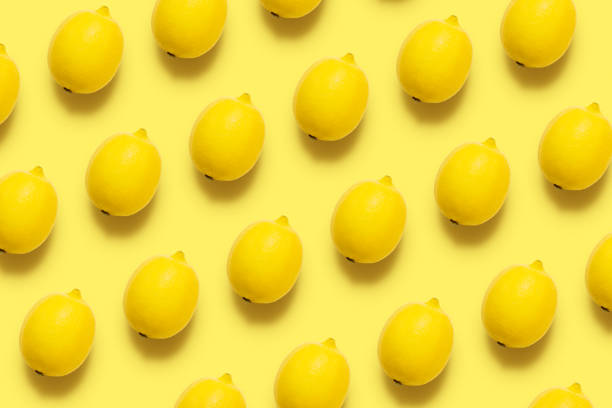 istock Lemon pattern on pastel yellow background. Minimal summer concept. Flat lay. 1153530210