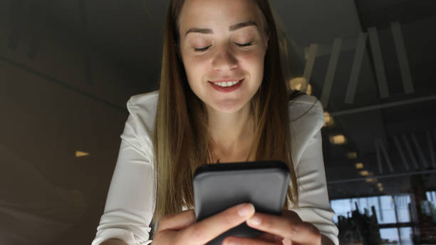 istock Young woman writing on her tablet 1153530252