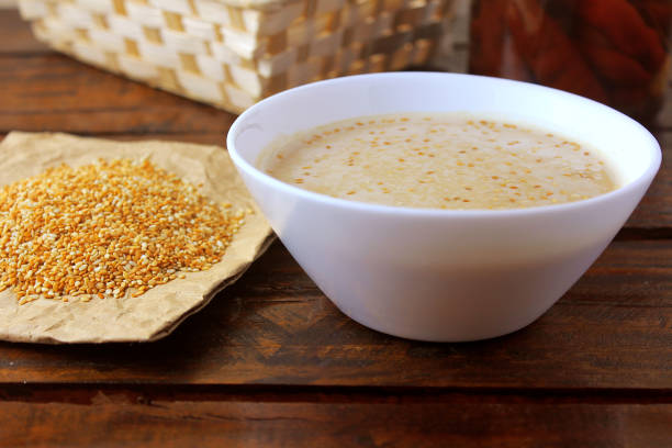 tahini in ceramic bowl on rustic wooden table- cream or paste made from sesame seeds (sesame) widely used in middle eastern cuisine - sesame seed spoon scoop imagens e fotografias de stock