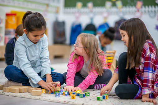 Middle school children learning in classroom setting.