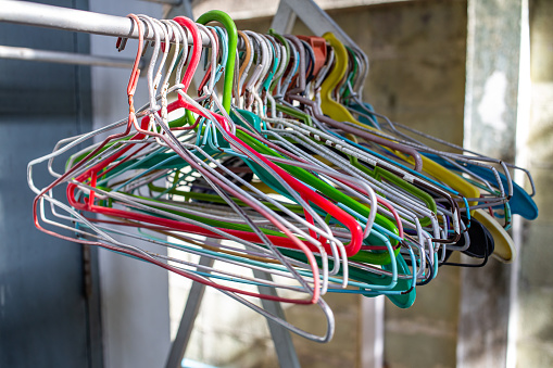 Old Colourful Plastic And Stainless Steel Clothes Hangers On Clothes Rack  Close Up Shot Selective Focus Light Shadow Laundry Work Concept Stock Photo  - Download Image Now - iStock