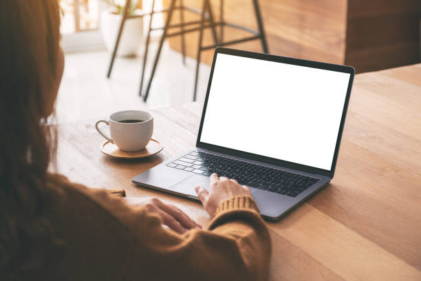 istock a woman using and touching on laptop touchpad with blank white desktop screen 1153554761