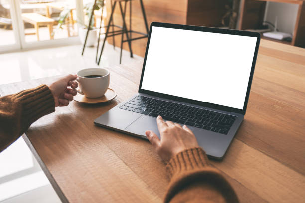 istock a woman using and touching on laptop touchpad with blank white desktop screen 1153554769