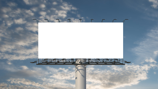 Blank billboard outdoor advertising at blue sky with clouds background. Space available for advertising ro your message