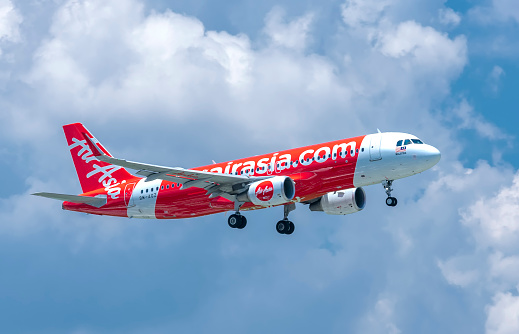 Ho Chi Minh City, Vietnam - June 1st, 2019: Passenger aircraft airbus A320 of Air Asia flying through clouds sky prepare to landing at Tan Son Nhat International Airport, Ho Chi Minh City, Vietnam