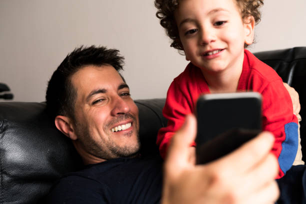 istock Father and son looking at the cellphone 1153562628