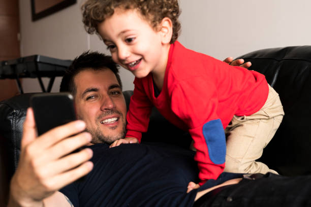 istock Father and son looking at the cellphone 1153562753