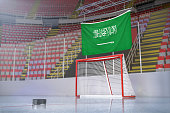 flagge-von-saudi-arabien-in-hockey-arena-mit-puck-und-netz.jpg?b=1&s=170x170&k=20&c=iFbqkBK-YtpI1Hv7LoPixEMyMWEAu930bzQoG4pwe3g=