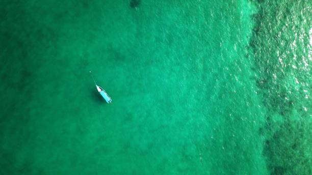 istock canoe and boat on beautiful tropical sea 1153566244