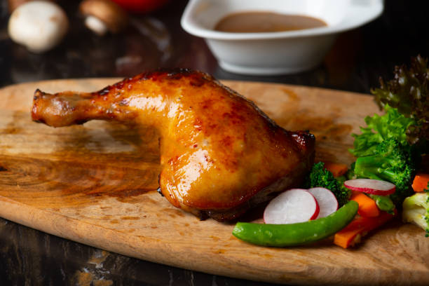 istock Roast chicken on cutting board with raw ingredients 1153566262