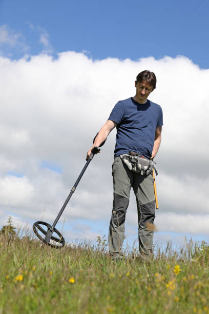 Man using metal detector stock photo