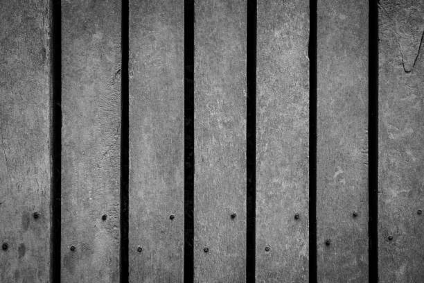 istock Black and white of Patterns on beautiful old wooden floor texture background 1153568319