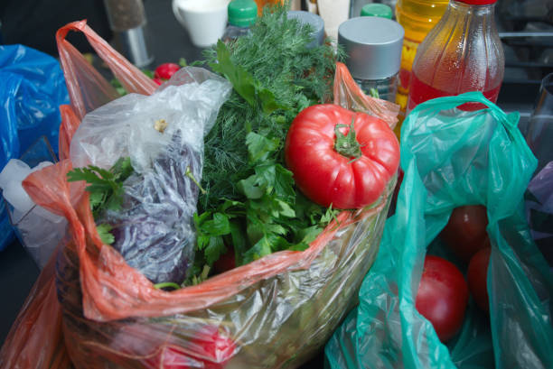 istock Plastic shopping bags full of vegetables 1153568472