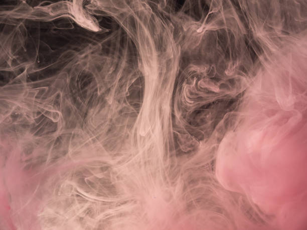 istock Pink acrylic smoke under water, abstract background. Close up view. Blurred background. Ink dissolving into water, abstract pattern. Acrylic clouds swirling in liquid. Background for abstract banner. 1153568506