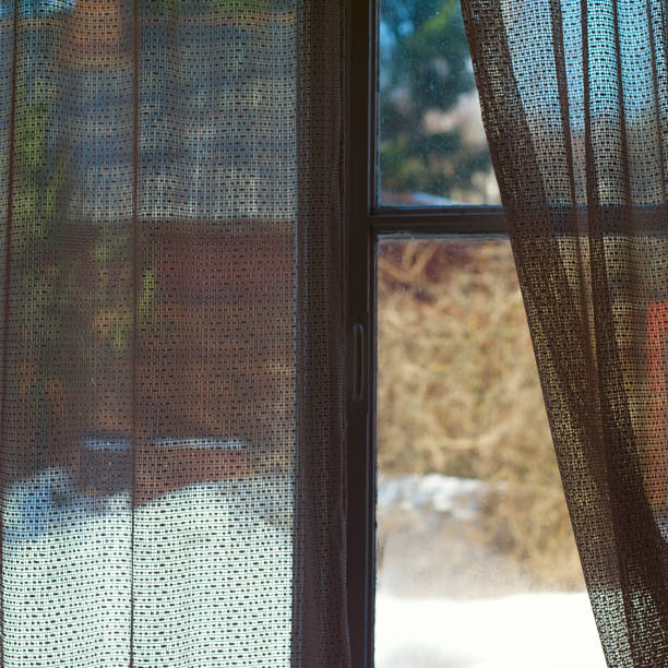 istock semi-transparent curtains on a window 1153568568