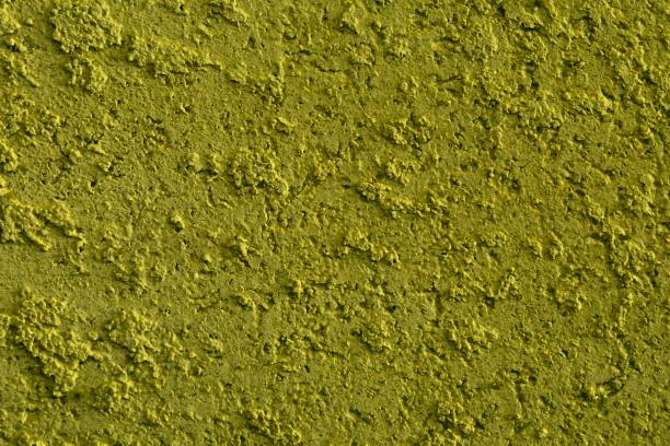 istock design aged yellow stone like plaster texture for design purposes. 1153568655
