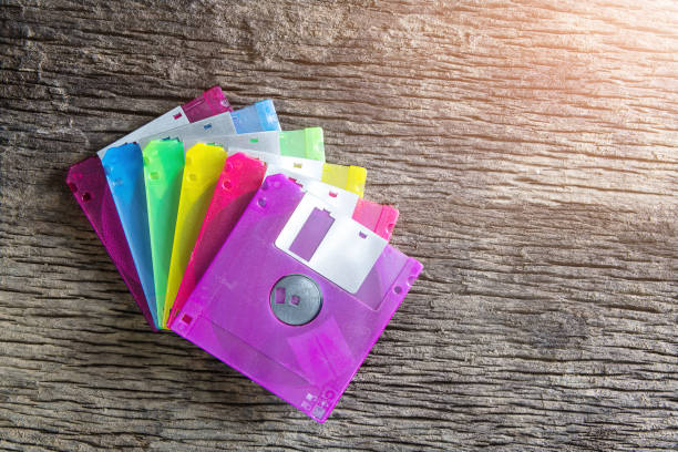 istock Floppy disks on a wooden table background. 1153570936