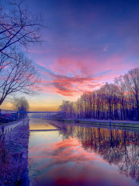 istock Dramatic and colorful sunrise over a beautiful river landscape 1153571613