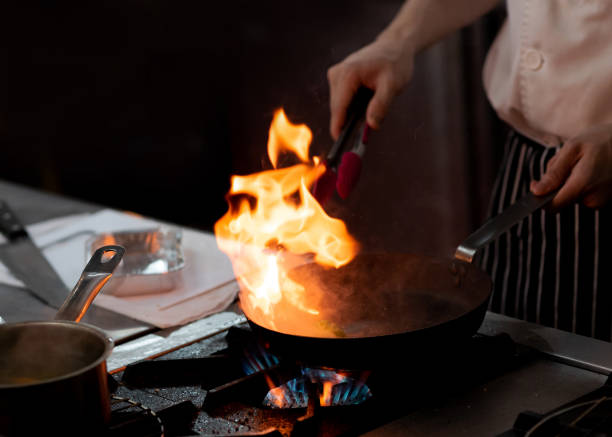 istock Chef preparing food in the kitchen, chef cooking, closeup 1153571856