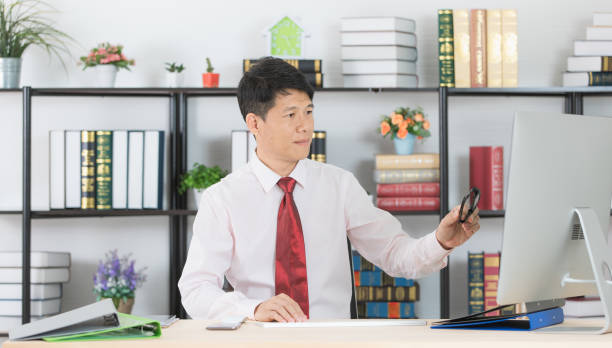 istock Asian business man at office 1153574791