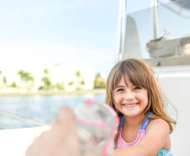 istock Boating with a child in swimsuit first person perspective 1153575512