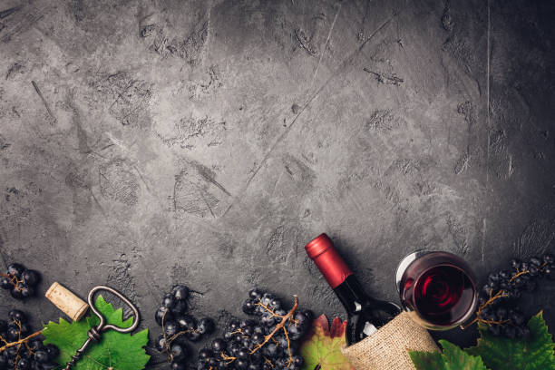 Wine composition on dark rustic background stock photo