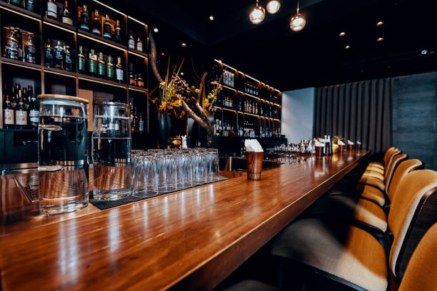 istock Modern empty night bar, wide angle near bar counter. 1153582461