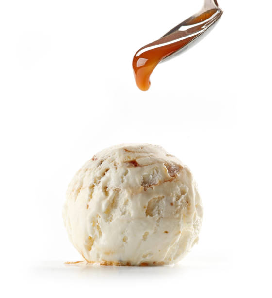 istock caramel sauce pouring on walnut ice cream 1153586469