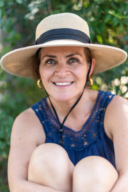 Smiling caucasian mature woman wearing a hat