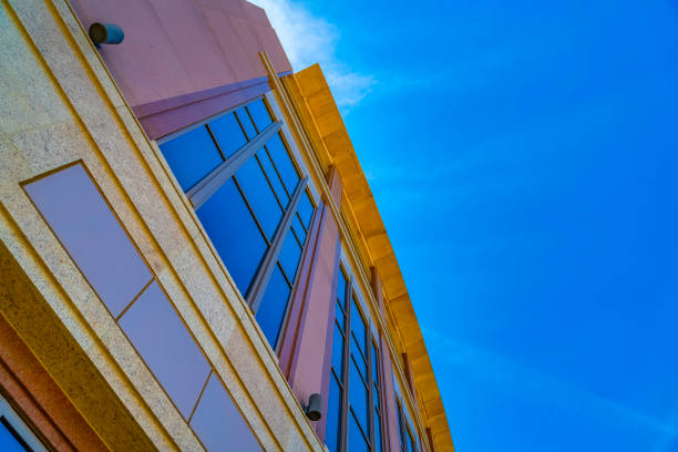 istock Commercial building exterior with cylindrical wall lights and blue windows 1153594949