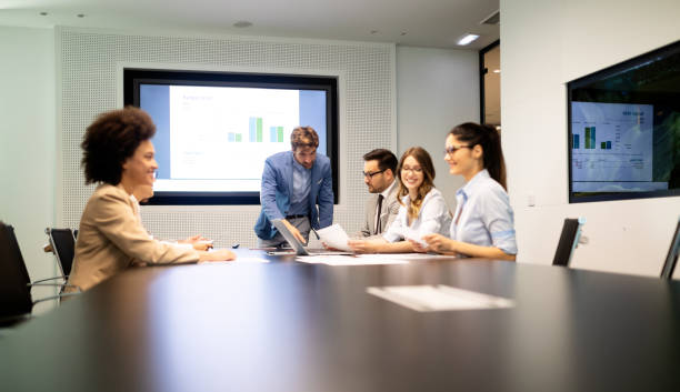 istock Group of successful business people at work in office 1153595092