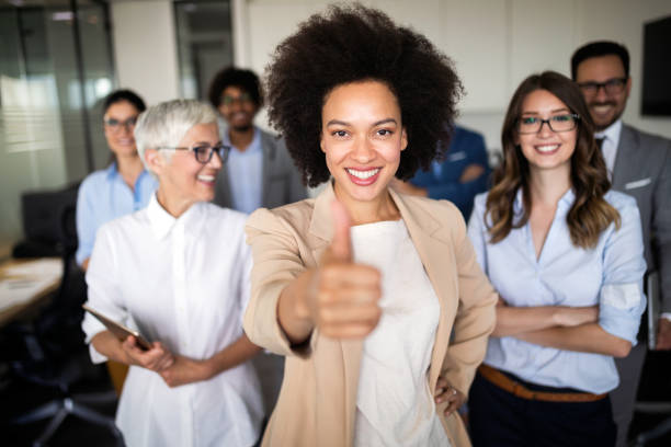 istock Group of successful business people at work in office 1153595208
