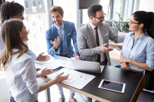 istock Group of successful business people at work in office 1153595387