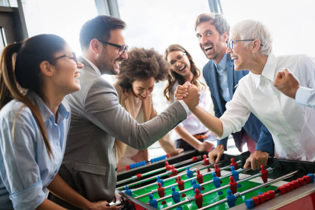 istock Excited diverse employees enjoying funny activity at work break, creative friendly workers play game 1153595410